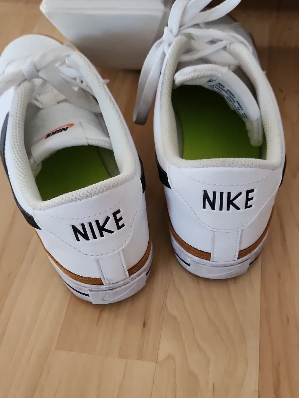 Nike White Leather Sneakers with Black Swoosh and Gum Trim